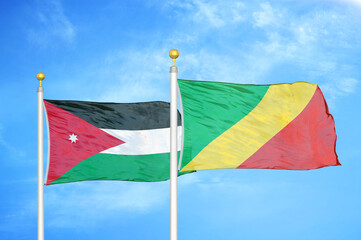 Jordan and Congo  two flags on flagpoles and blue cloudy sky