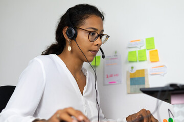 Young brazilian woman working from home