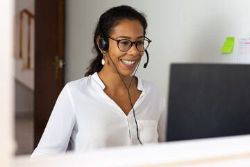 Young brazilian woman working from home