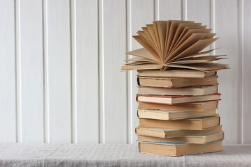 stack of old books on the table.
