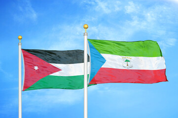 Jordan and Equatorial Guinea two flags on flagpoles and blue cloudy sky