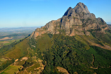 The mountain in the foreground is called Simonsberg Mountain, named after Simon van der Stel. The town in the background is Stellenbosch, named after Simon van der Stel, first governor of the town.