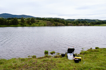 Fototapeta na wymiar Fishing chair on the river bank