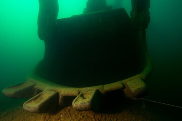 Excavator wreck in a fresh water lake.