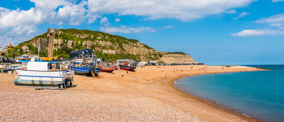 The curve of Hastings beach provides shelter of fishing boats in summer