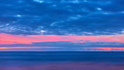 Fototapeta na wymiar Atlantic ocean and sky with clouds after sunset