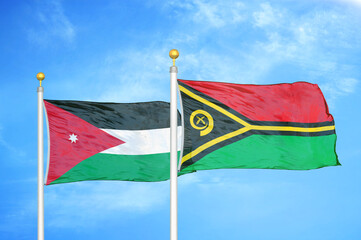 Jordan and Vanuatu two flags on flagpoles and blue cloudy sky