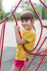 Foto op Canvas schattig 6 jaar oud meisje op de speelplaats © Albert Ziganshin