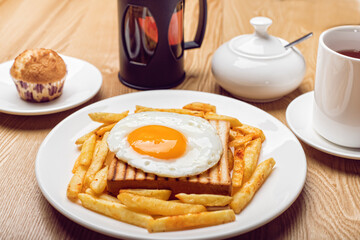 Obraz na płótnie Canvas breakfast with coffee toast and fried egg