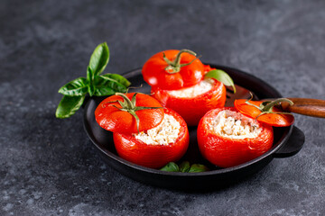 Stuffed tomatoes with cheese and basil, appetizer