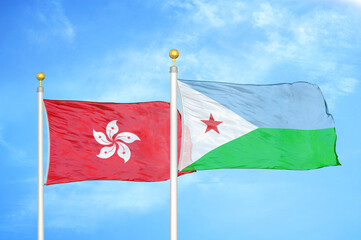 Naklejka na ściany i meble Hong Kong and Djibouti two flags on flagpoles and blue cloudy sky