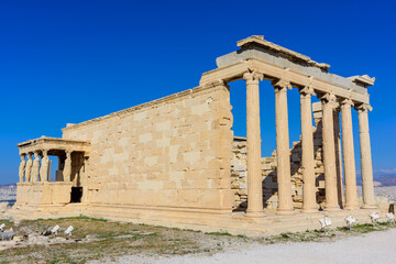 The Erechtheion is a temple in the Acropolis of Athens Honoring Athena and Poseidon, this famous, ancient Greek temple features a porch with 6 caryatids. 