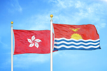 Hong Kong and Kiribati two flags on flagpoles and blue cloudy sky