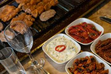 Different types of meat grilled on Barbecue on the table, Served with special Turkish appetizers and Turkish raki