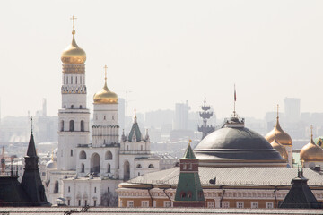Fototapeta na wymiar Moscow, Russia. The Kremlin view from long distance with telephoto. Ivan The Great bell-tower.