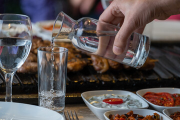 Different types of meat grilled on Barbecue on the table, Served with special Turkish appetizers and Turkish raki