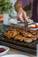 Different types of meat grilled on Barbecue on the table, Served with special Turkish appetizers and Turkish raki