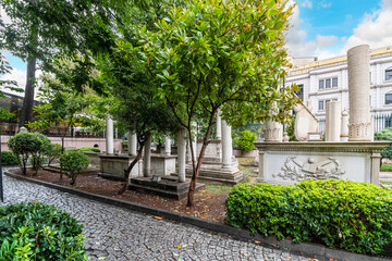 Historic interior courtyard of the Ahmet Tevfik Paşa Tomb filled with marbled headstones, graves and memorials to Turkey's rulers and sultans.