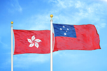 Hong Kong and Samoa two flags on flagpoles and blue cloudy sky