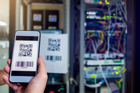 Scanning QR code payment with blurry computer network system in data center room. Accepted generate digital pay without money. E wallet and cashless technology concept.  - Powered by Adobe