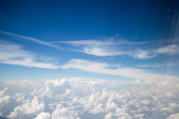Fototapeta na wymiar Sky and clouds from aeroplane window