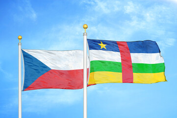 Czech and Central African Republic two flags on flagpoles and blue cloudy sky