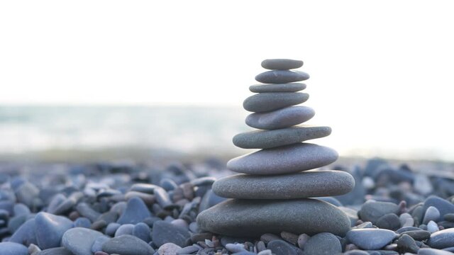 Balanced pyramid of stones on the beach