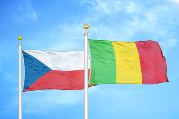 Czech and Mali two flags on flagpoles and blue cloudy sky