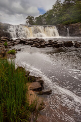 Aasleagh falls water fall in county Mayo, Ireland. Popular tourist spot. Part of Wild Atlantic Way. Vertical image.