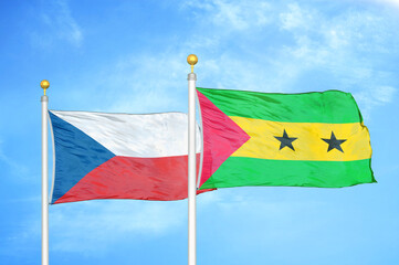 Czech and Sao Tome and Principe two flags on flagpoles and blue cloudy sky