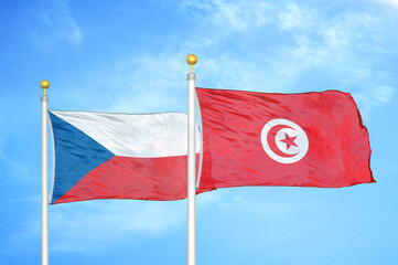 Naklejka na ściany i meble Czech and Tunisia two flags on flagpoles and blue cloudy sky