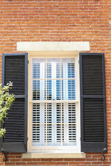 Fototapeta na wymiar Window with shutters inside and outside