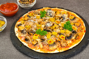 Pizza with mussels, mushrooms, green olives