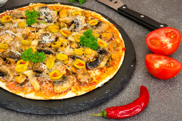 Pizza with mussels, mushrooms, green olives