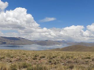 Obraz premium landscape with mountains, lake and blue sky with clouds