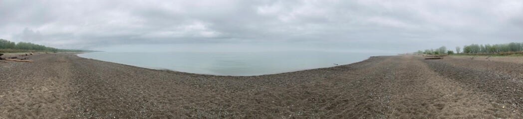 Fototapeta na wymiar Panorama of Lake Erie sandy Beach on A Cloudy Day