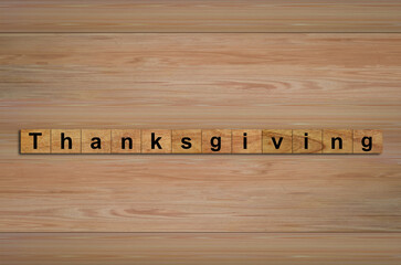 Happy Thanksgiving written on wood cubes. message text on wooden table for backdrop design.