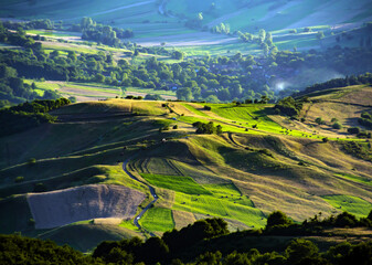 Fototapeta premium lights and shadows in the evening on the hills