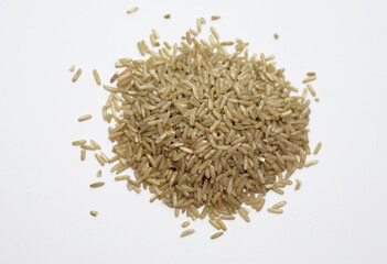 Natural brown rice on a white background
