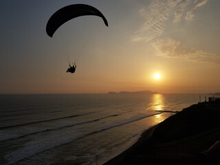 Paragliding on sunset at Miraflores, Lima, Peru