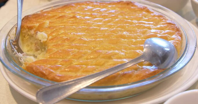 person serving a baked tapioca pie