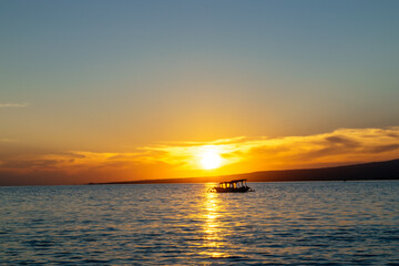 Fototapeta na wymiar A boat in the tropical sunset at low tide Gili Trawangan Island, Lombok, Indonesia