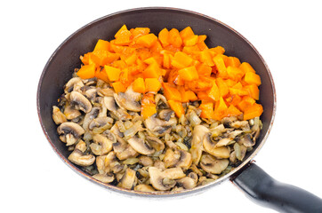 Vegetarian vegetable stew of pumpkin and mushrooms in pan, white background.
