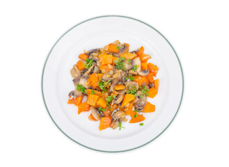 White plate with vegetarian food of vegetables, pumpkin, mushrooms