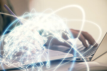 Multi exposure of woman hands typing on computer and business theme hologram drawing. Success...