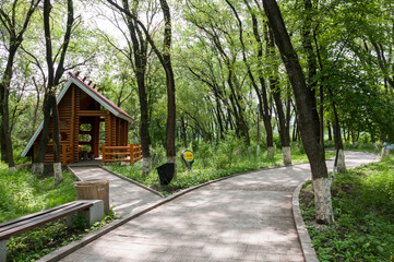 China, Heihe, July 2019: a Wooden holiday house in a Park on the waterfront in Heihe city in the summer
