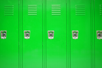 facade view of lockers in school gym painted in green color