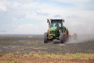 Fototapeta premium truck putting fire down on crop field
