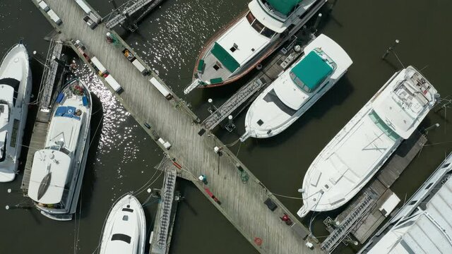 overhead view of dock pulling back to reveal 79th St. Boat Basin on west side of NYC