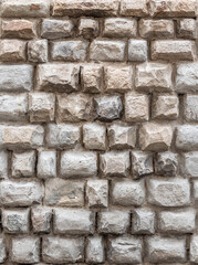Background of antique wall made of hewn natural stone